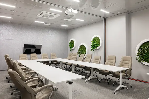 Ceiling-mounted microphone array positioned above a conference table