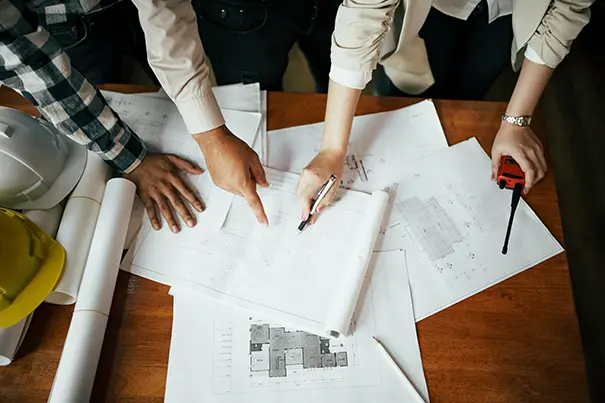 AV and project teams coordinating drawings to produce a single AV design package