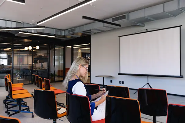 Trainer leading a session in a multi-purpose AV room